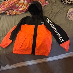 The North Face Kids Orange and Black Raincoat